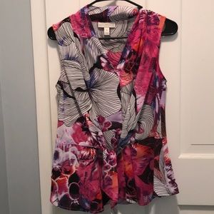 Sleeveless top with tie front waist.